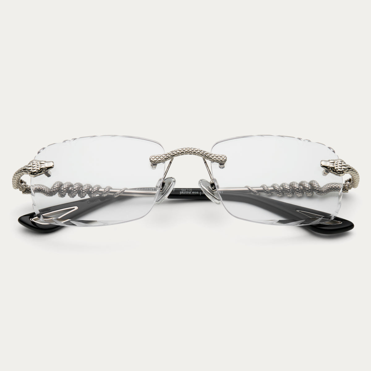 CLEAR SILVER SERPENT GEM CUT